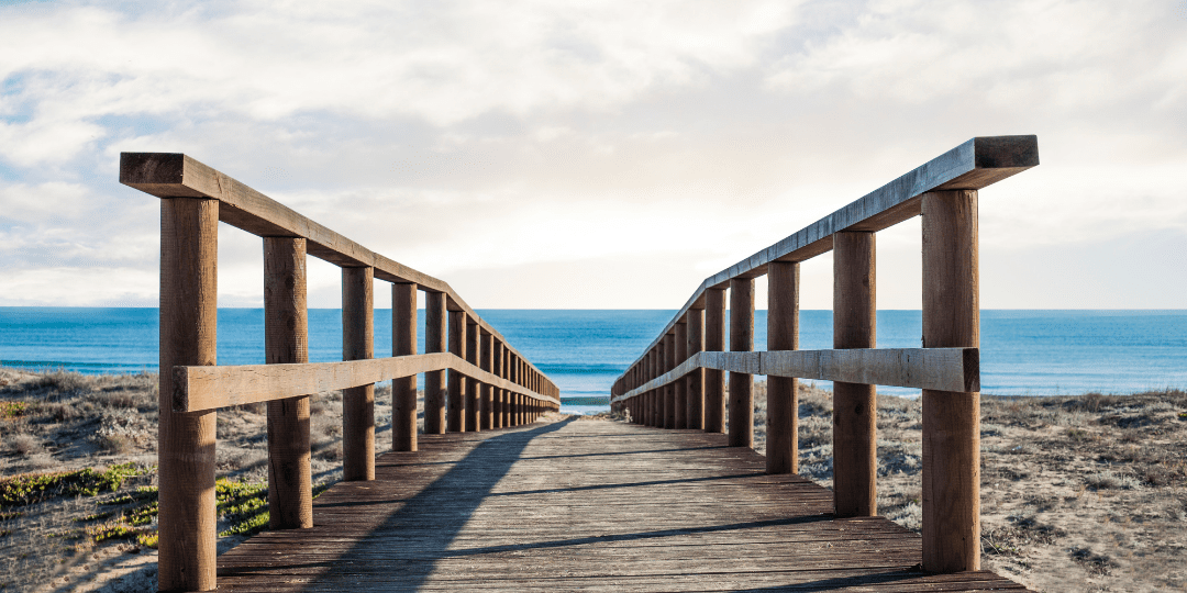 wooden footbridge over the sand